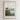 The image is a framed poster with a coastal scene featuring two houses on a cliff overlooking the ocean. The poster has a minimalist design with a focus on the houses and the ocean.