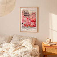 a bedroom scene with a framed poster of a cityscape hanging on the wall above a bed with striped bedding.