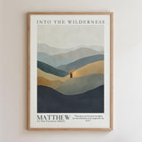 The image is a framed poster with a landscape scene depicting mountains and a person standing in the middle of the mountains. The poster has a minimalist design with a focus on the natural elements.