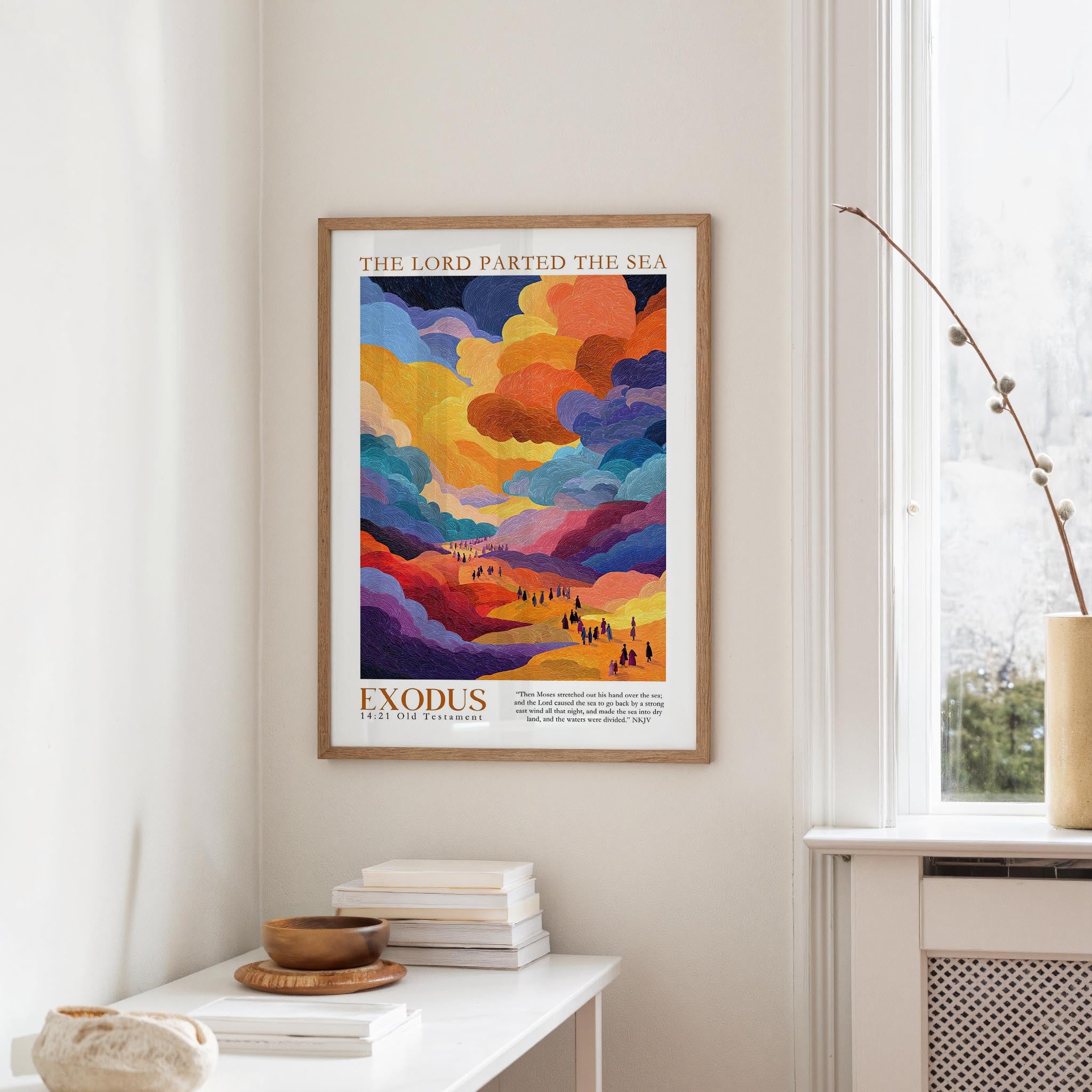 a framed poster of a colorful landscape with a text overlay that reads "The Lord Parted the Sea" and "Exodus 21:11 Old Testament".