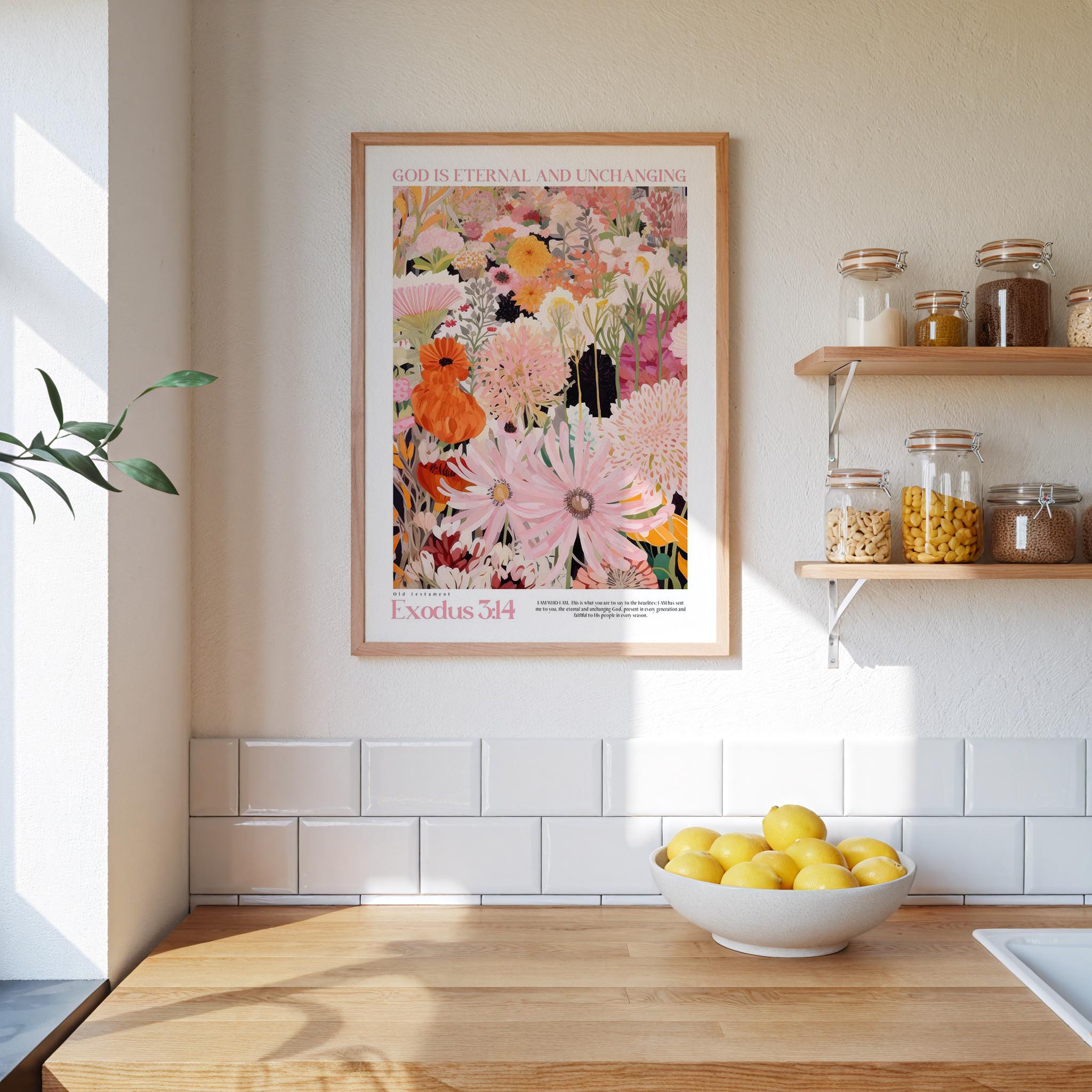 a kitchen scene with a framed poster of a colorful floral design hanging on the wall above a wooden countertop with a bowl of lemons.