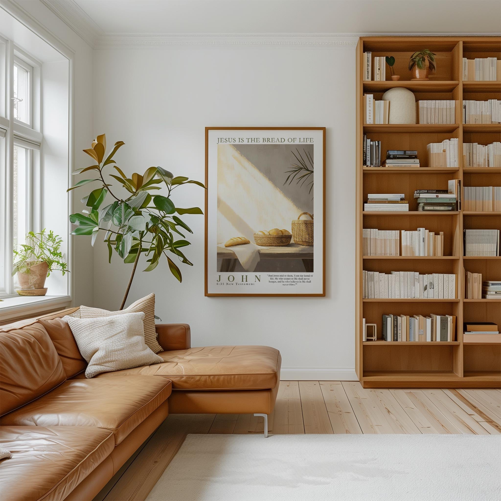 a cozy living room with a large bookshelf filled with books, a comfortable leather sofa, and a framed poster of a loaf of bread on the wall.