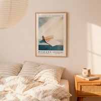 a bedroom setting with a framed poster of a book and a wooden nightstand with a coffee cup and a book.