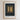 The image is a framed poster with a black background and a white border. The poster features a single candle in a window frame, with a quote from the New Testament about the light of the world.