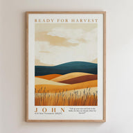 The image is a framed poster with a landscape depicting a field with tall grass and rolling hills. The poster has a minimalist design with a focus on the natural elements.