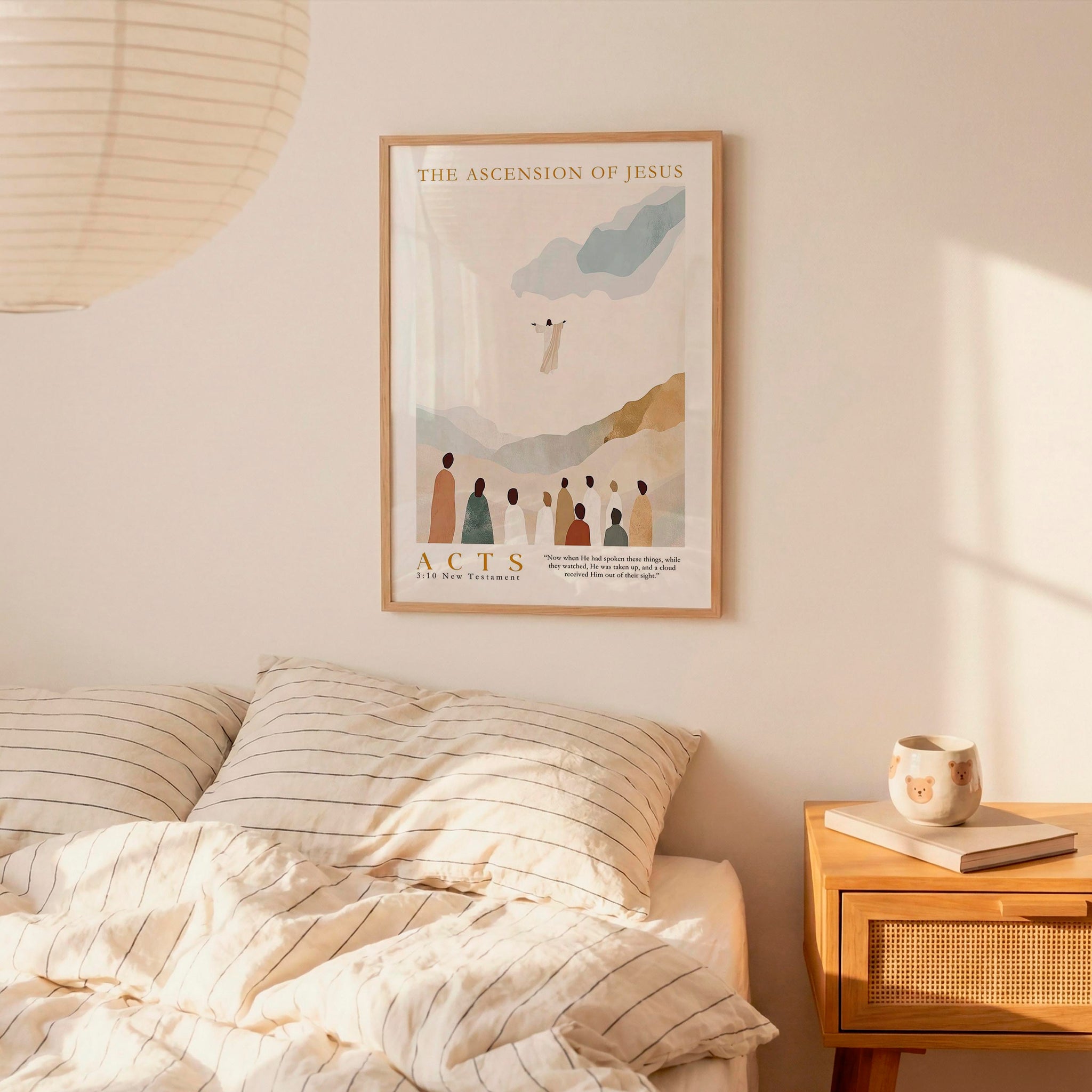 a bedroom scene with a framed poster of a religious illustration hanging on the wall above a bed with striped bedding.