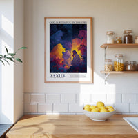 A framed poster of a colorful illustration of a group of people is hanging on a wall above a wooden countertop with a bowl of lemons.