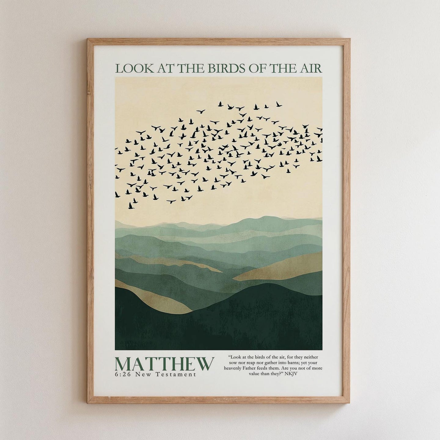The image is a framed poster with a minimalist design featuring a flock of birds flying over a mountainous landscape. The text on the poster reads "Look at the birds of the air" and "MATTHEW 26 New Testament".