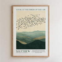 The image is a framed poster with a minimalist design featuring a flock of birds flying over a mountainous landscape. The text on the poster reads "Look at the birds of the air" and "MATTHEW 26 New Testament".