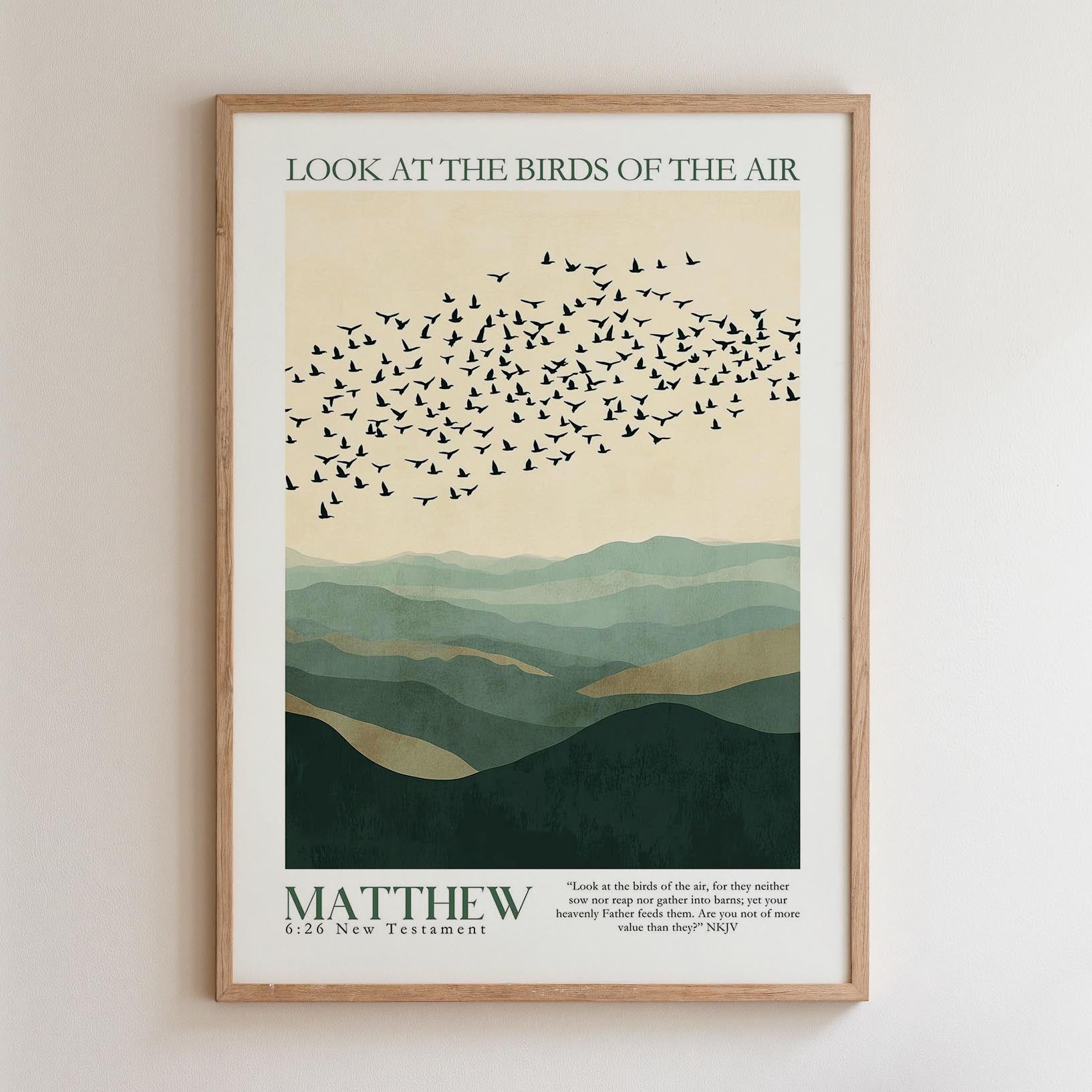 The image is a framed poster with a minimalist design featuring a flock of birds flying over a mountainous landscape. The text on the poster reads "Look at the birds of the air" and "MATTHEW 26 New Testament".