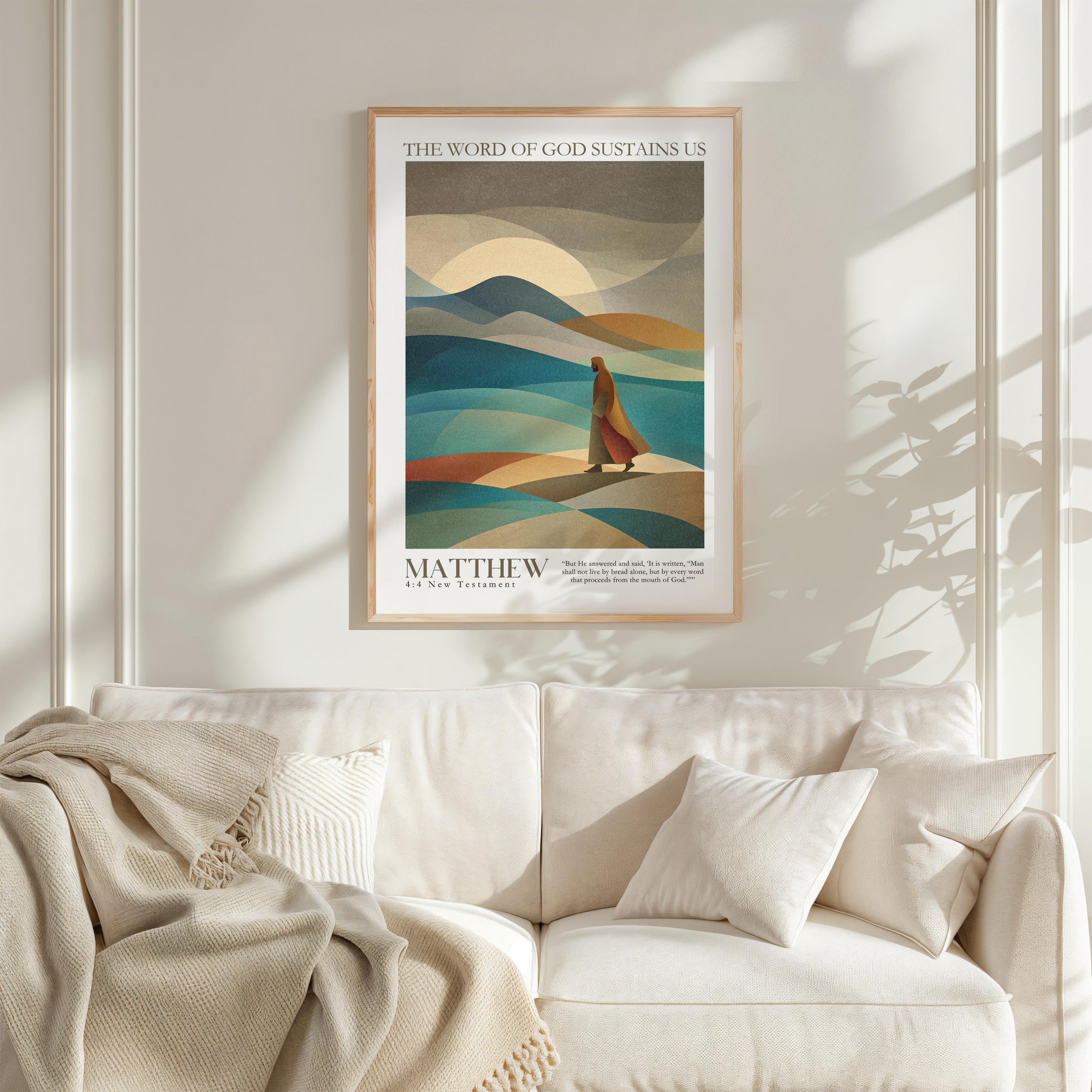 a framed poster of a person walking in a desert landscape, with mountains in the background.