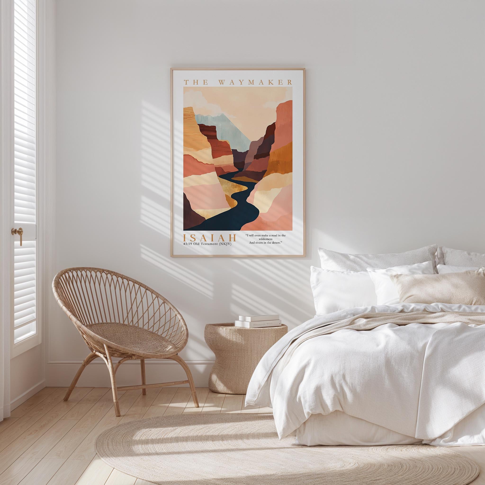 a serene bedroom scene with a large bed, a woven chair, and a framed poster of a mountain landscape.
