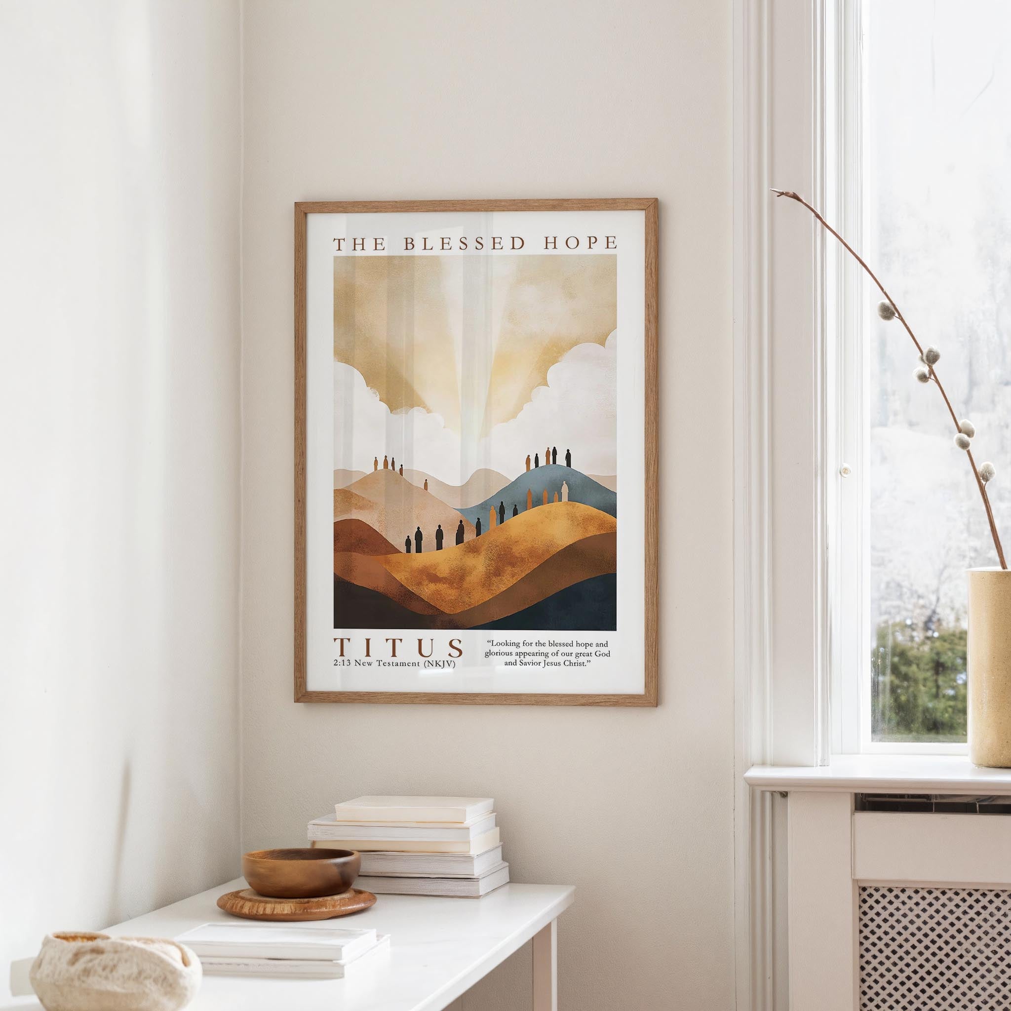 a framed poster of a landscape with mountains and clouds hanging on a wall in a room.
