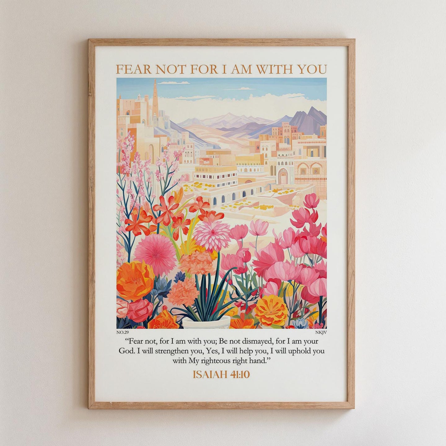 The image is a framed poster with a colorful illustration of a cityscape and flowers. The poster includes a Bible verse from Isaiah 40:10, which encourages the viewer to "Fear not, for I am with you" and to "Be not dismayed, for I am your God. I will strengthen you, Yes, I will help you, I will uphold you with My righteous ways."