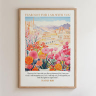 The image is a framed poster with a colorful illustration of a cityscape and flowers. The poster includes a Bible verse from Isaiah 40:10, which encourages the viewer to "Fear not, for I am with you" and to "Be not dismayed, for I am your God. I will strengthen you, Yes, I will help you, I will uphold you with My righteous ways."
