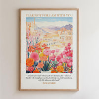 The image is a framed poster with a colorful illustration of a cityscape and flowers. The poster includes a Bible verse from Isaiah 40:10, which encourages the viewer to "Fear not, for I am with you" and to "Be not dismayed, for I am your God. I will strengthen you, Yes, I will help you, I will uphold you with My righteous ways."