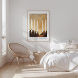 a serene bedroom scene with a bed, a woven chair, and a framed poster on the wall.