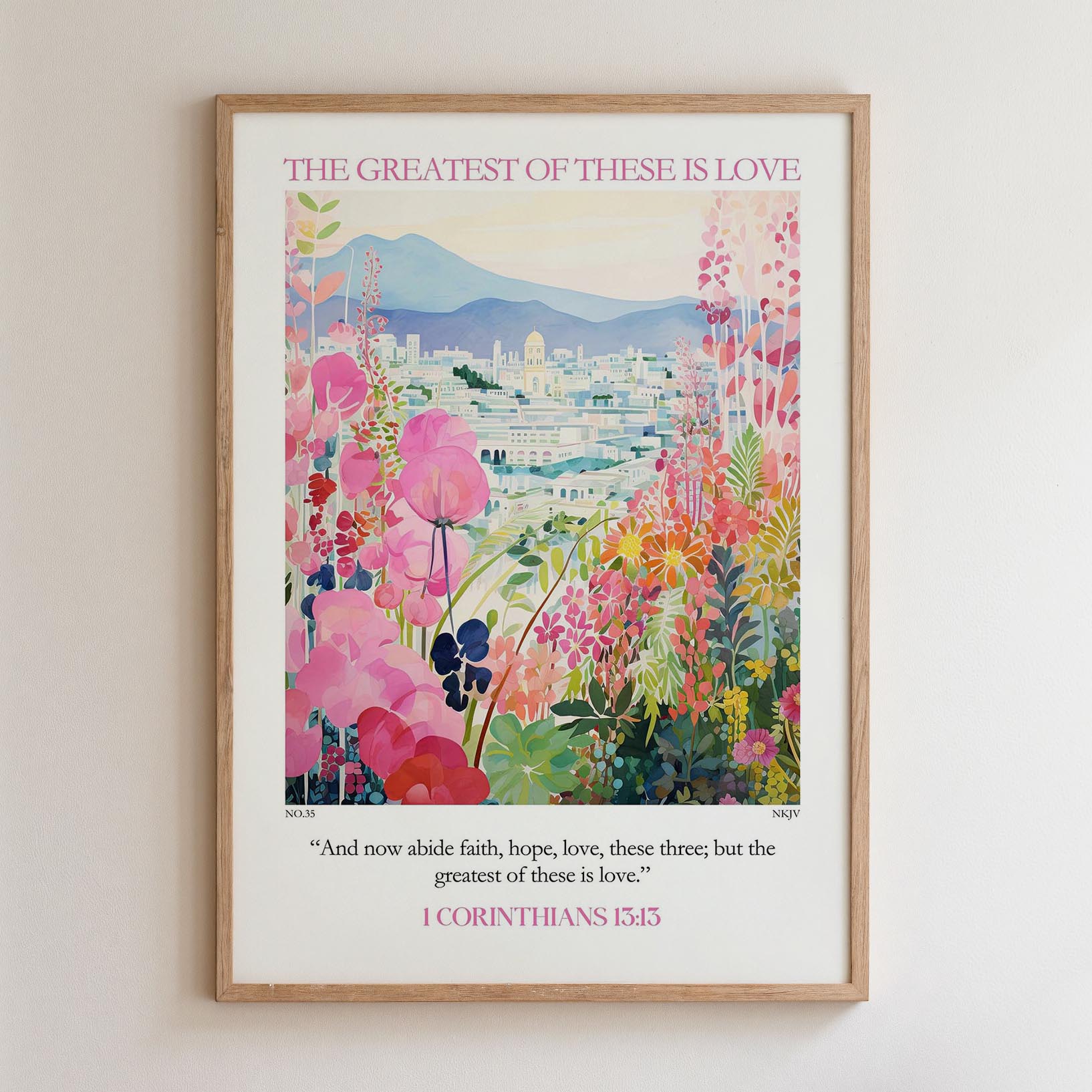 The image is a framed poster with a vibrant, colorful illustration of a cityscape surrounded by flowers and greenery. The poster features a quote from the Bible verse 1 Corinthians 13:15, which states "And now able faith, hope, love; these three; but the greatest of these is love."
