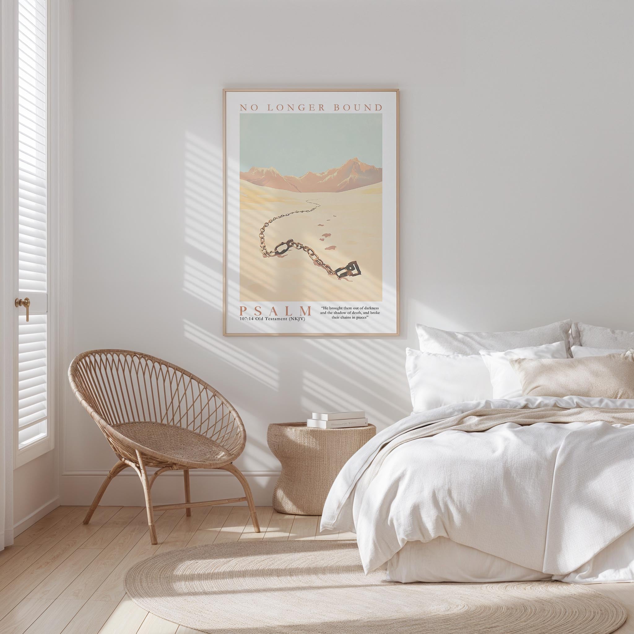 A bedroom with a bed, a woven chair, and a framed poster on the wall.