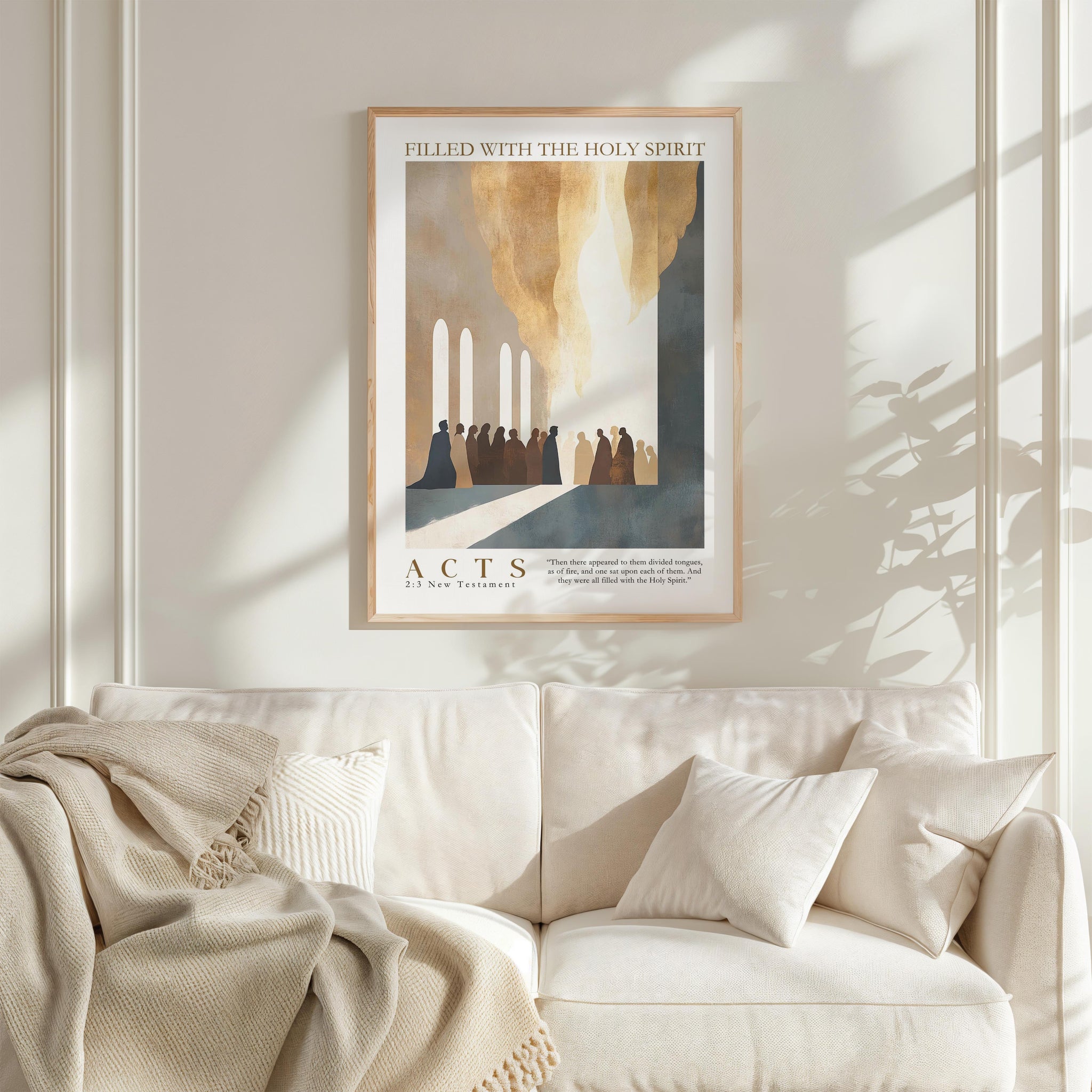 a framed poster of a religious scene, with a group of people gathered in a church or religious building. The poster is hung on a wall above a white couch, which is adorned with a blanket and pillows.