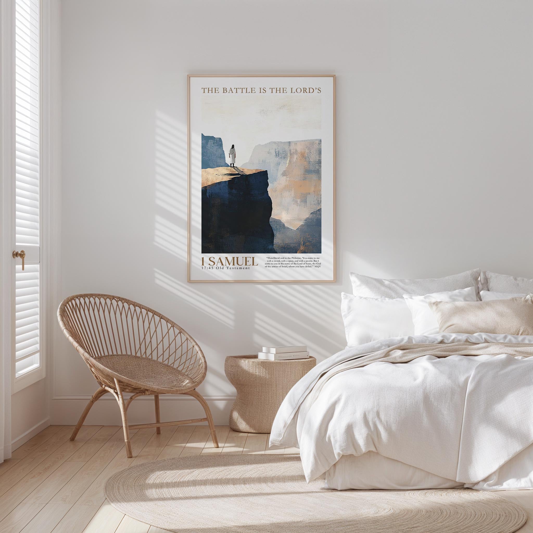 a serene bedroom scene with a bed, a woven chair, and a framed poster of a mountain landscape.