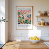 A framed poster of a desert landscape with mountains in the background hangs on a wall above a wooden countertop with a bowl of lemons.