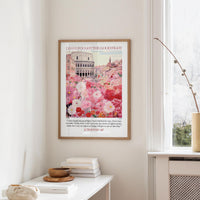 a framed poster of a cityscape with a quote from 2 Timothy 1:7, "I have fought the good fight," hanging on a wall in a room with a window and a small table with books and a bowl.