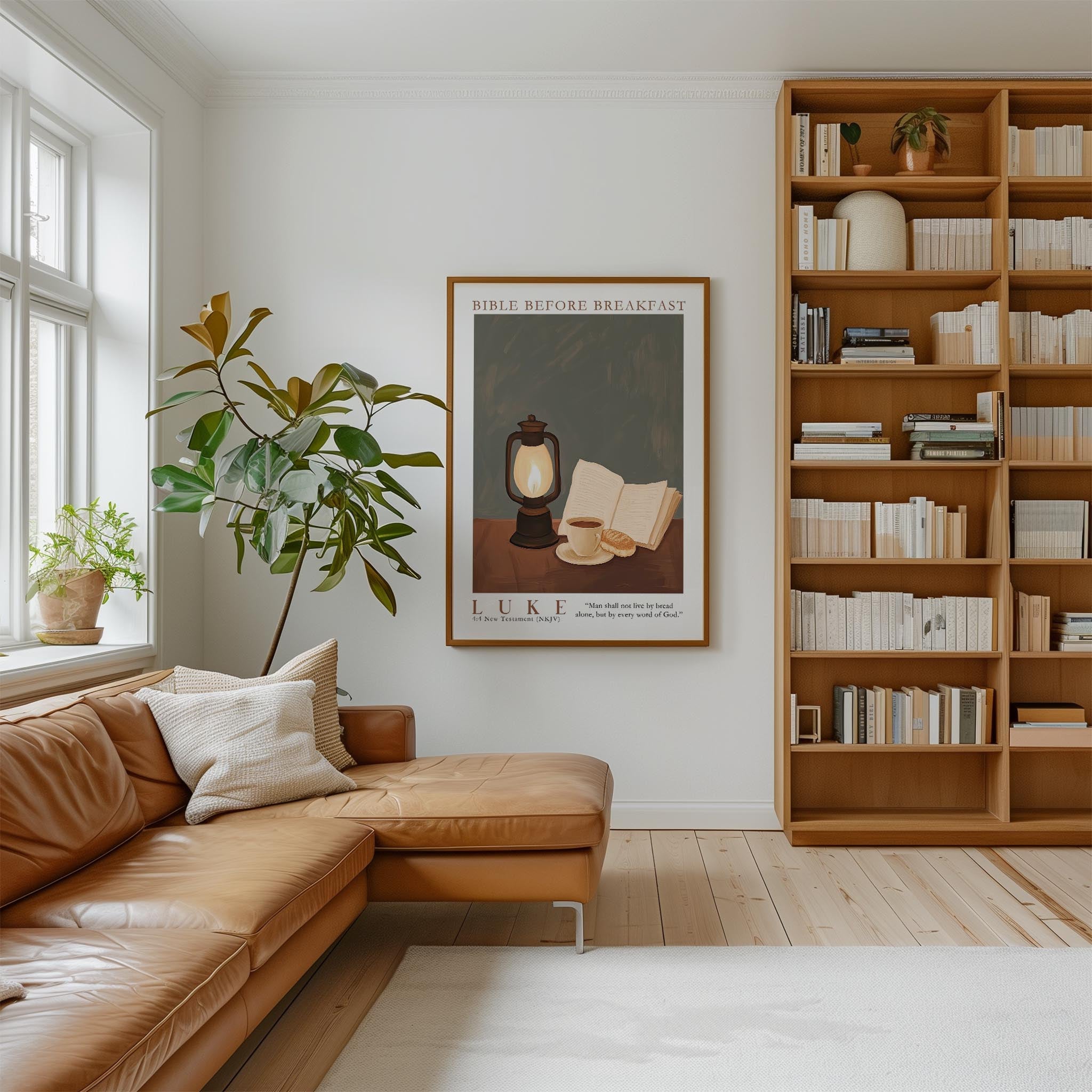 a cozy living room with a large bookshelf filled with books, a comfortable leather sofa, and a framed poster of a lantern and a cup on a table.