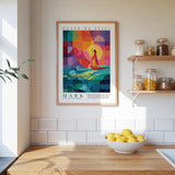a kitchen counter with a bowl of lemons, a plant, and a framed poster of a colorful abstract design hanging on the wall above it.