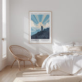 a bedroom with a bed, a woven chair, and a poster of the Ten Commandments hanging on the wall.