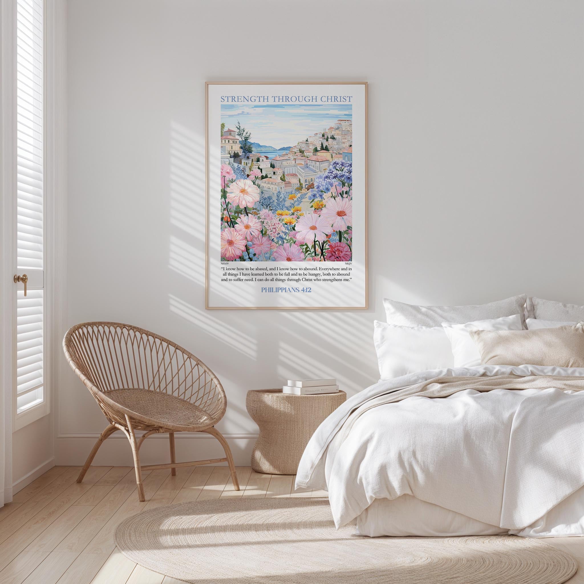 a bedroom with a bed, a wicker chair, and a framed poster of a colorful floral landscape hanging on the wall.
