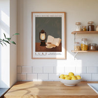 a kitchen scene with a framed poster of a lantern, a bowl of lemons, and a shelf with jars of food.