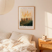 a bedroom scene with a framed poster of a group of people on the wall above a bed with striped bedding.