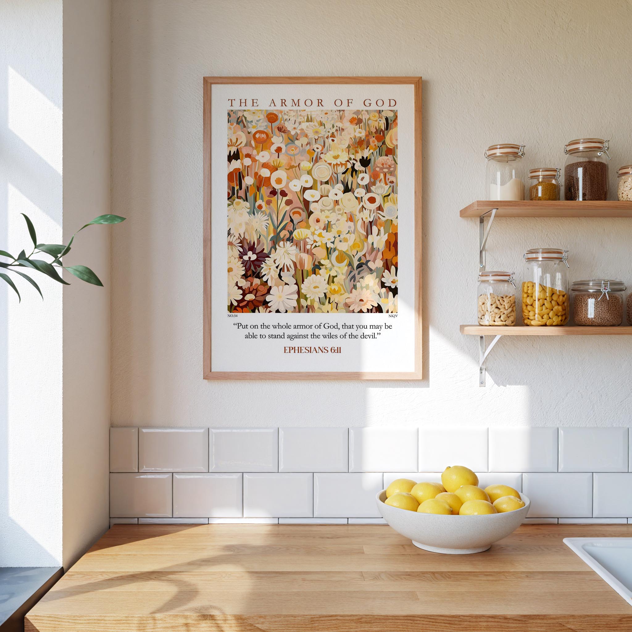 a kitchen scene with a framed poster of a floral design on the wall above a wooden countertop with a bowl of lemons.