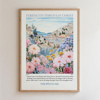 The image is a framed poster with a painting of a cityscape filled with colorful flowers and buildings. The poster is titled "STRENGTH THROUGH CHRIST" and includes a Bible verse from Philippians 4:12.