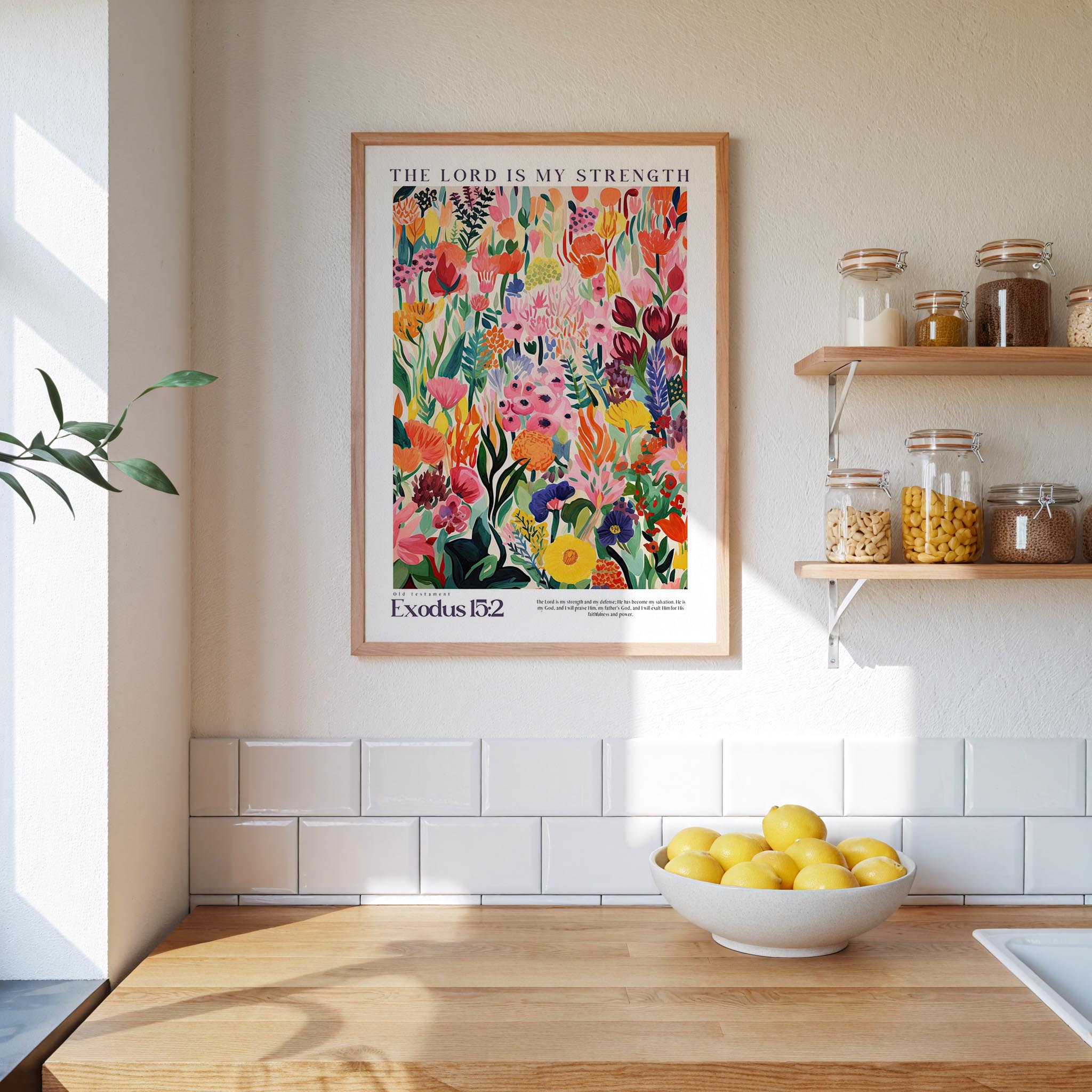 a kitchen scene with a framed poster of a colorful floral design hanging on the wall above a wooden countertop with a bowl of lemons.