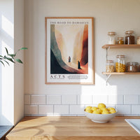 a kitchen counter with a bowl of lemons, a framed poster of a desert landscape, and a shelf with jars and containers.