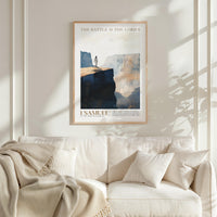a framed poster of a person standing on a cliff, with a text overlay that reads "THE BATTLE IS THE LORD'S".