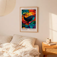 a poster of a whale hanging on a wall above a bed with striped pillows.