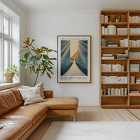 a cozy living room with a large bookshelf filled with books, a comfortable leather couch, and a framed poster of a spiral staircase on the wall.