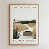 The image is a framed poster depicting a serene landscape with a well in the foreground, surrounded by tall grasses and a winding path leading to the well. The poster is titled "The Living Water" and features a quote attributed to John from the 10 New Testament (NkJ).