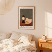 a bedroom scene with a framed poster of a book and a lantern on a bed, a wooden nightstand with a coffee cup and a book, and a lamp hanging above the bed.