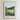 The image is a framed poster depicting a pastoral scene with a stone wall, grassy field, and flowers. The text above the poster reads "THE LORD IS MY SHEPHERD" and below the image is the text "PSALM 23 1:1 Old Testament ( NKJV )".