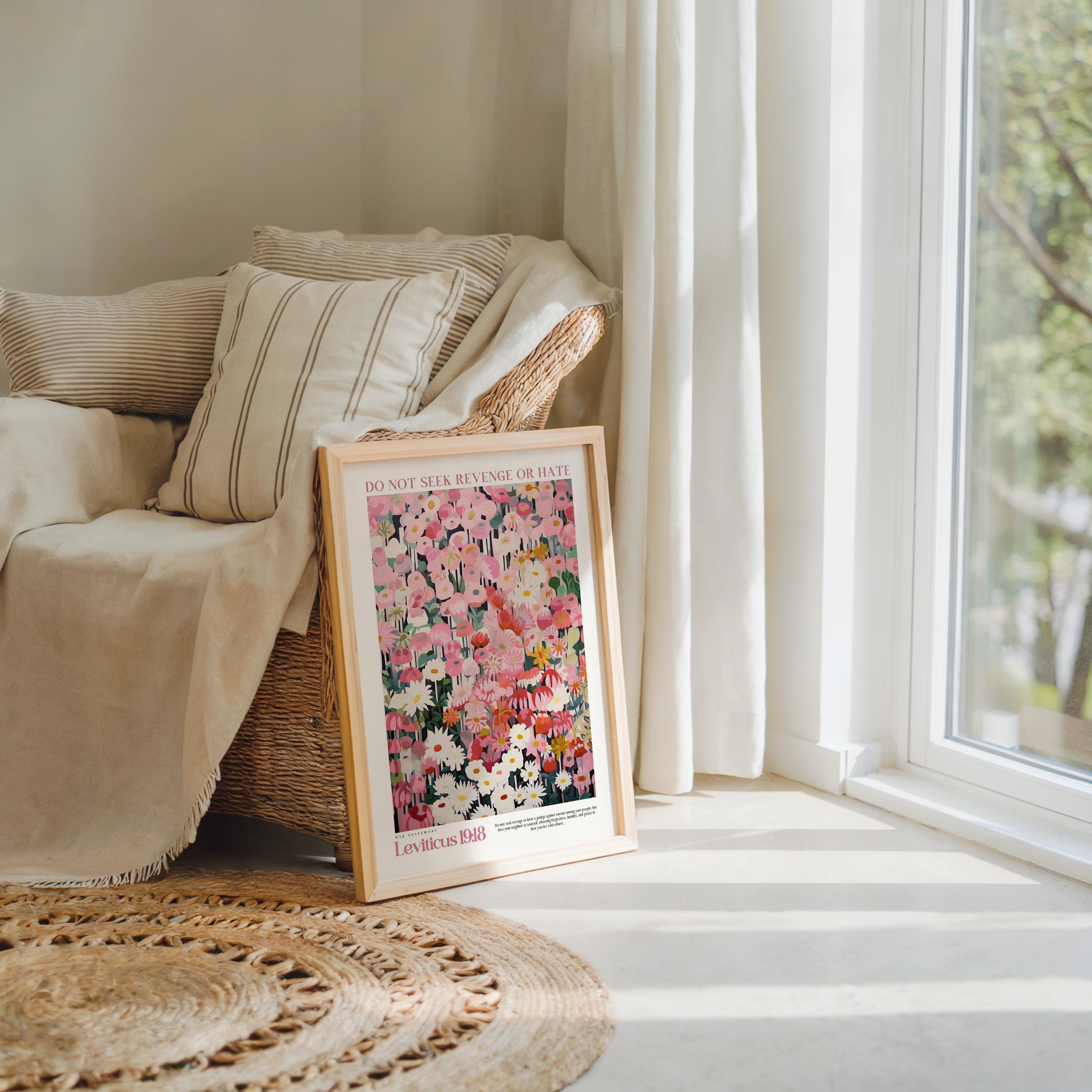 a framed poster of a floral design, placed on a rug in a living room setting.