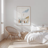 a serene bedroom scene with a bed, a woven chair, and a framed poster of a religious figure above the bed.