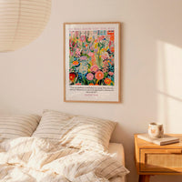 a bedroom setting with a bed, a nightstand, and a poster on the wall. The poster is a colorful floral print with text that reads "He will show you the way".