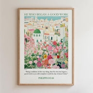 The image is a framed poster with a colorful illustration of a cityscape filled with flowers and greenery. The poster is titled "HE WHO BEGAN A GOOD WORK" and includes a quote from the Bible verse Philippians 16:1-3.