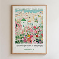 The image is a framed poster with a colorful illustration of a cityscape filled with flowers and greenery. The poster is titled "HE WHO BEGAN A GOOD WORK" and includes a quote from the Bible verse Philippians 16:1-3.