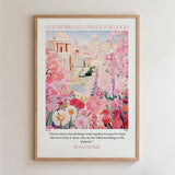 The image is a framed poster with a colorful illustration of a cityscape surrounded by flowers. The poster features a quote from Romans 8:28 that states "And we know that all things work together for good to those who love God, to those who are the called according to His purpose."