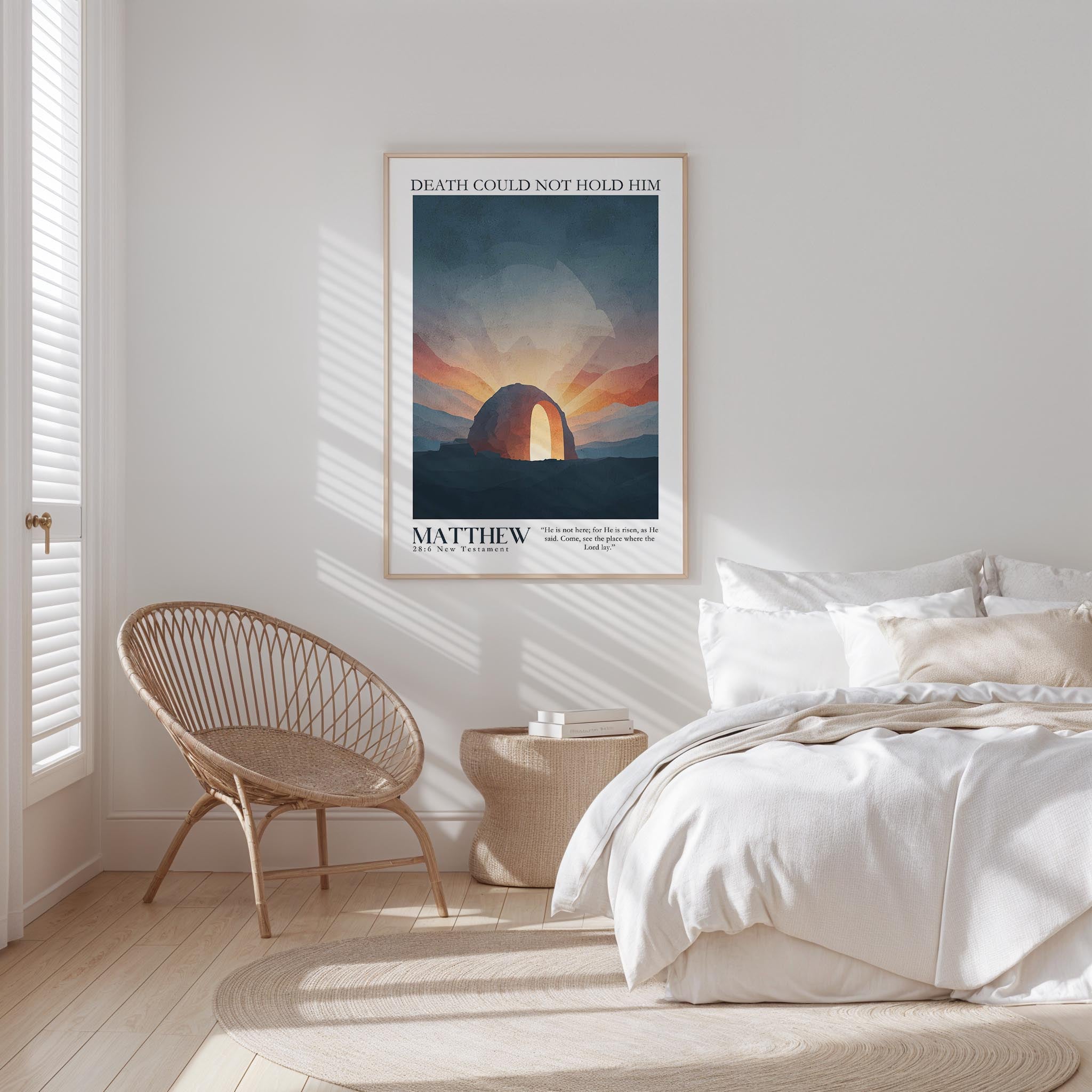 a bedroom with a bed, a woven chair, and a framed poster on the wall.